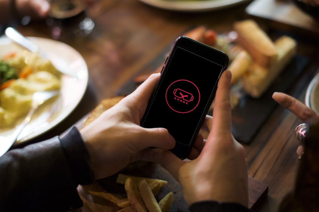 Image of a phone, displaying XRBax logo